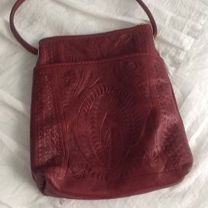 Red embossed leather bag